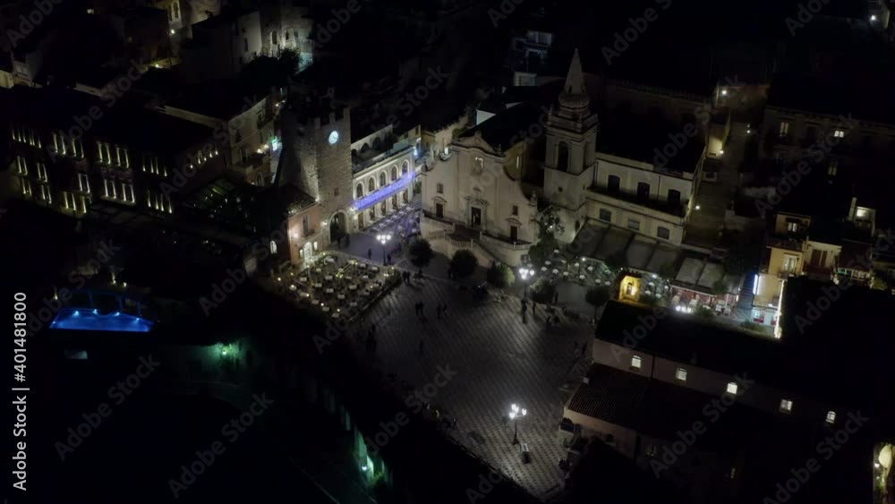 Piazza IX Aprile in Taormina in Sicily, Italy during the evening with tourists. Piazza IX Aprile in Taormina in Sicily, Italy during the evening with tourists.