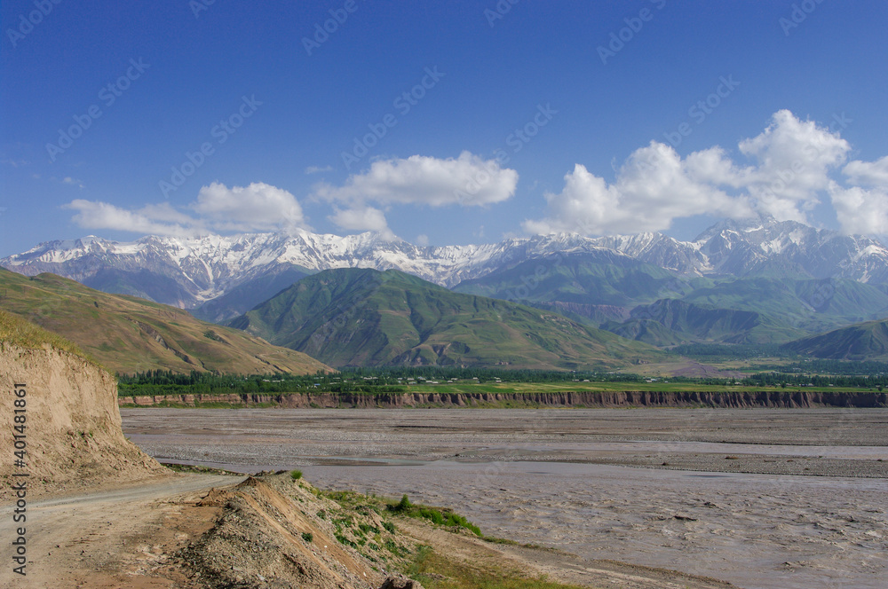Panoramic view of the snow-capped Academy of Sciences mountain range with Surkhob river in foreground near Garm in the Rasht valley, Tajikistan