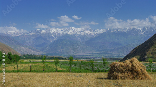 Stunning countryside view of the snow-capped Academy of Sciences mountain range near Garm in the Rasht valley, Tajikistan