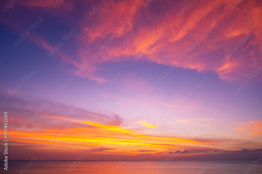 Landscape Long exposure of majestic clouds in the sky sunset or sunrise over sea with reflection in the tropical sea Beautiful cloudscape scenery Amazing light of nature Landscape