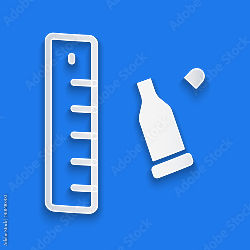 Paper cut Bullet casing as a piece of evidence placed with forensic ruler for documentation icon isolated on blue background. Concept of crime scene. Paper art style. Vector.
