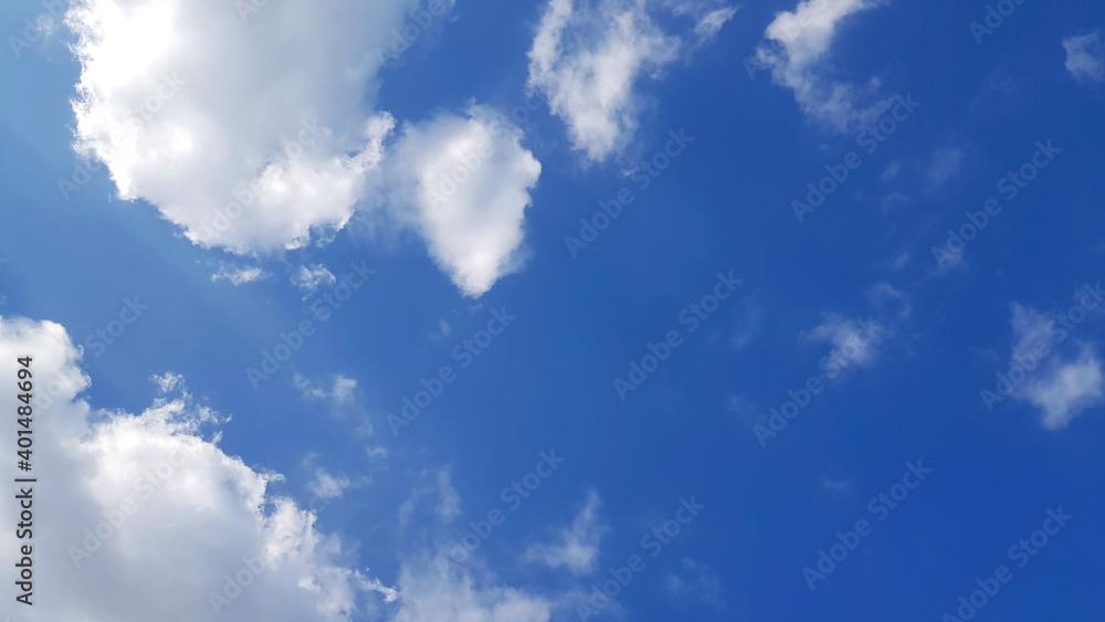 Blue sky with white clouds with copy space on right. Natural wallpaper, Beauty in nature and View on top. Blue sky with white clouds with copy space on right. Natural wallpaper, Beauty in nature and View on top.