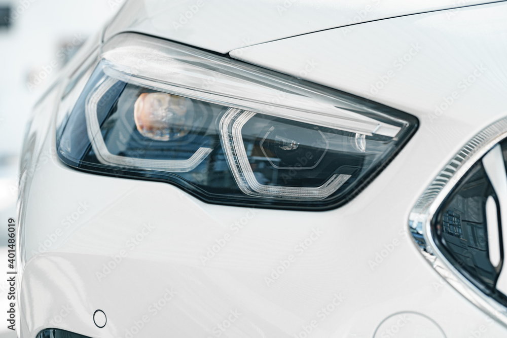 Headlights of a new white luxury car