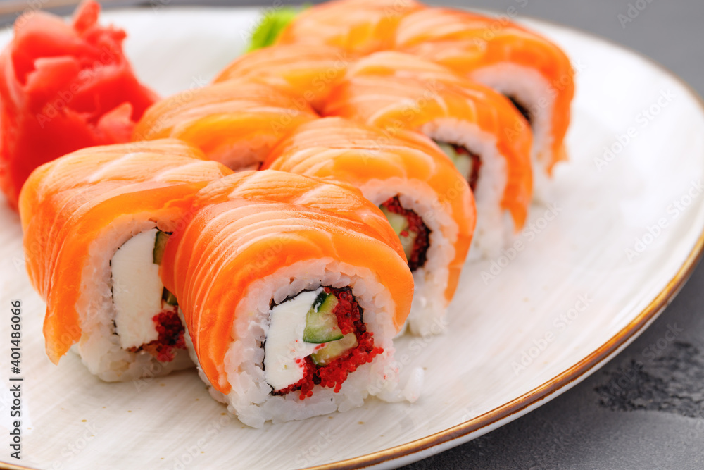 Philadelphia sushi roll on plate close up Philadelphia sushi roll on plate close up