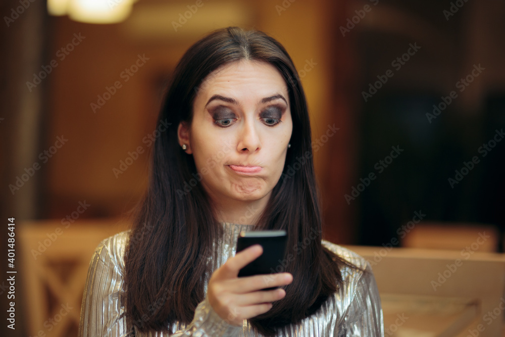 Sad Woman Reacting to a Rude Text Message Sad Woman Reacting to a Rude Text Message