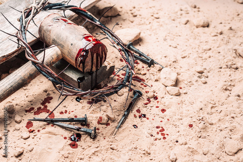 Fototapeta Bloody nails, crown of thorns with drops of blood over grunged background