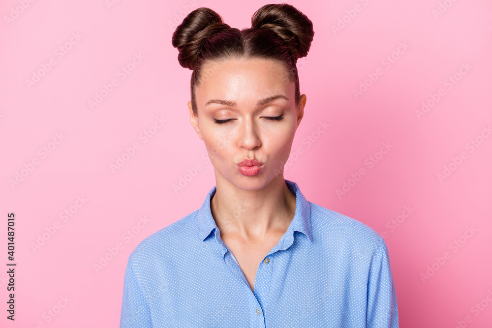 Photo portrait of romantic flirty girlfriend sending air kiss closed eyes isolated on pastel pink color background Photo portrait of romantic flirty girlfriend sending air kiss closed eyes isolated on pastel pink color background