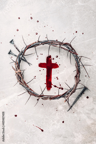 Crucifix made of blood, crown of thorns. Good friday. Easter holiday. Christian cross painted with blood on stone background. Passion, crucifixion of Jesus Christ. Gospel, salvation concept