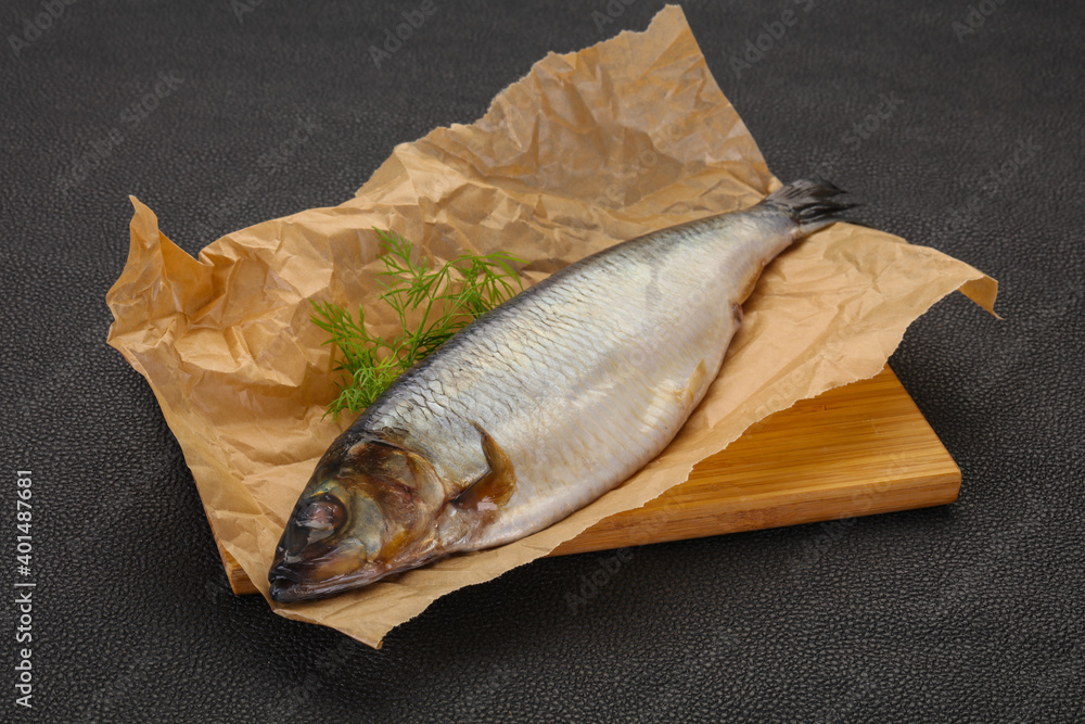 Salted herring over the wooden board