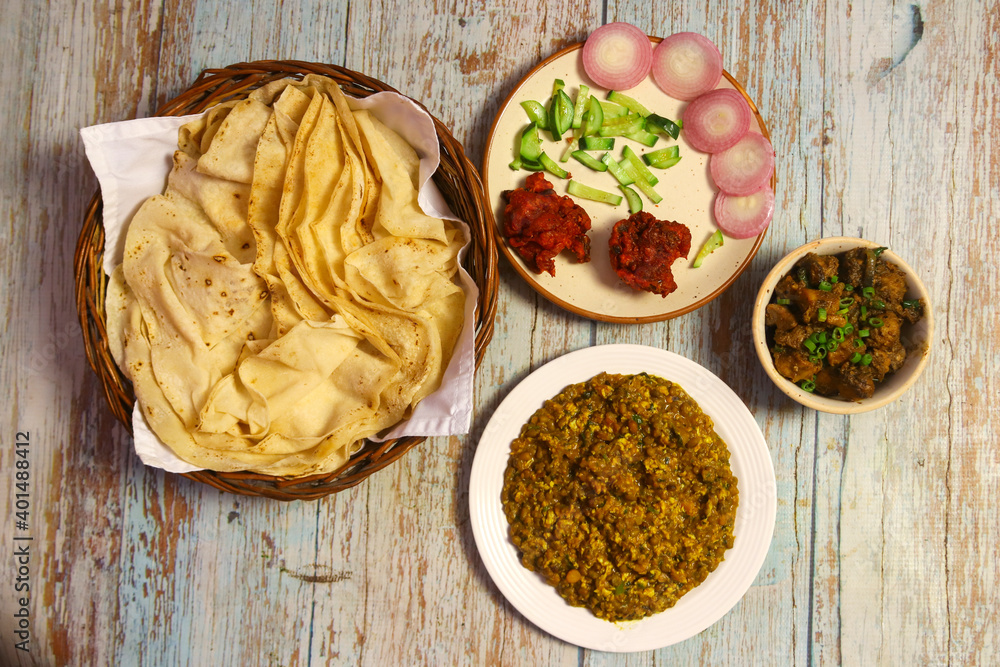 Rumali roti, daal tadka, chicken kosha and chicken pakoda with salad Rumali roti, daal tadka, chicken kosha and chicken pakoda with salad