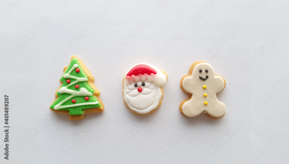 Christmas icon decoration on butter cookies on white background