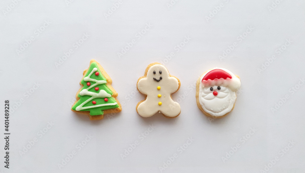 Christmas icon decoration on butter cookies on white background Christmas icon decoration on butter cookies on white background
