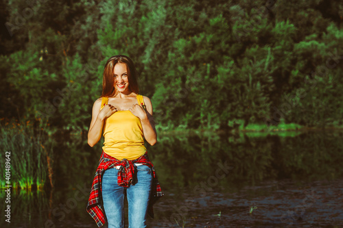 beautiful girl standing by the river