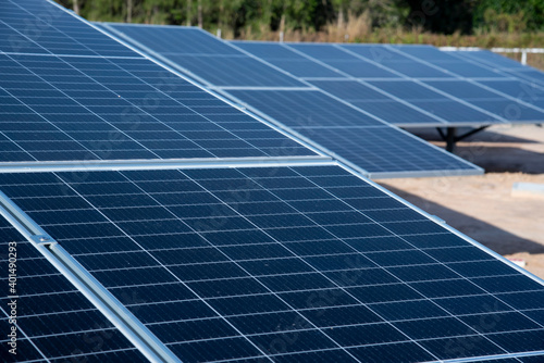 Photovoltaic renewable energy solar farm site for electrical supply for future. Green energy is main power for future. © behindlens