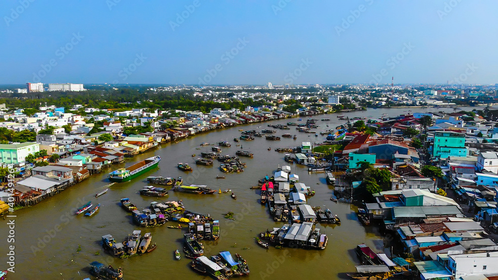 Aerial view of Cai Rang floating market, Can Tho, Vietnam. Cai Rang is famous market in mekong delta, Vietnam. Tourists, people buy and sell food, vegetable, fruits on boat, ship