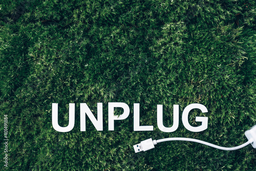 Принти на полотні Word Unplug, white internet usb adapter on moss, green grass background