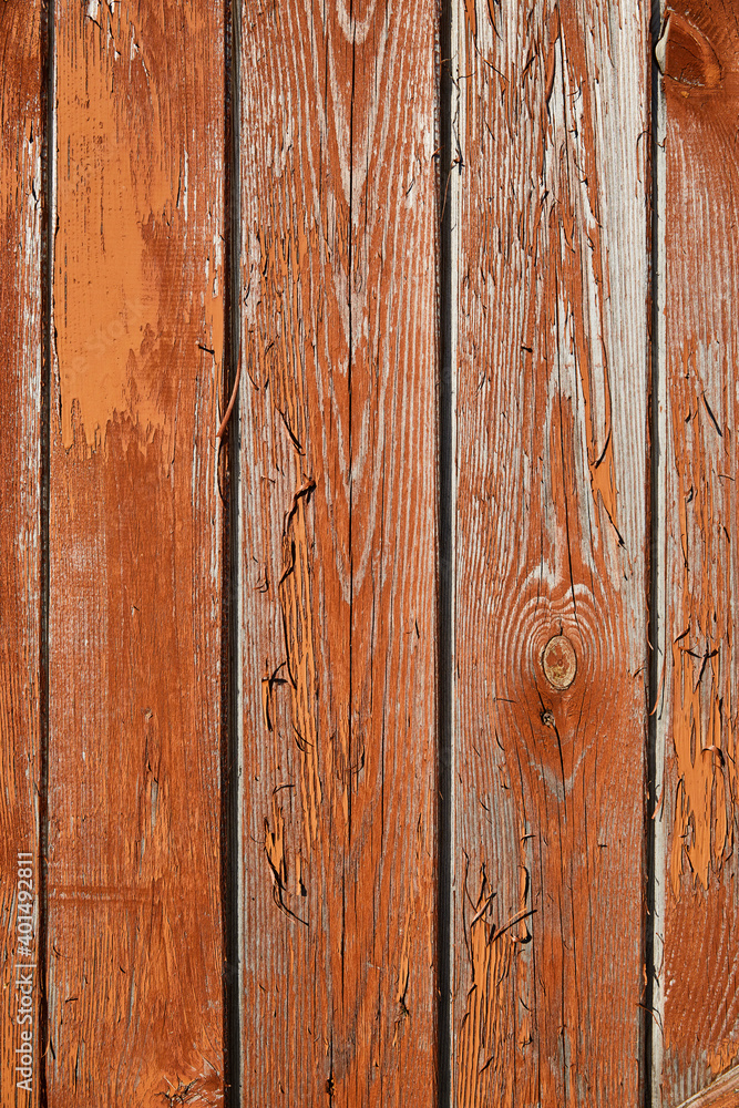 Grunge wooden background with texture, old rough boards with orange-brown peeling and cracked old paint Grunge wooden background with texture, old rough boards with orange-brown peeling and cracked old paint