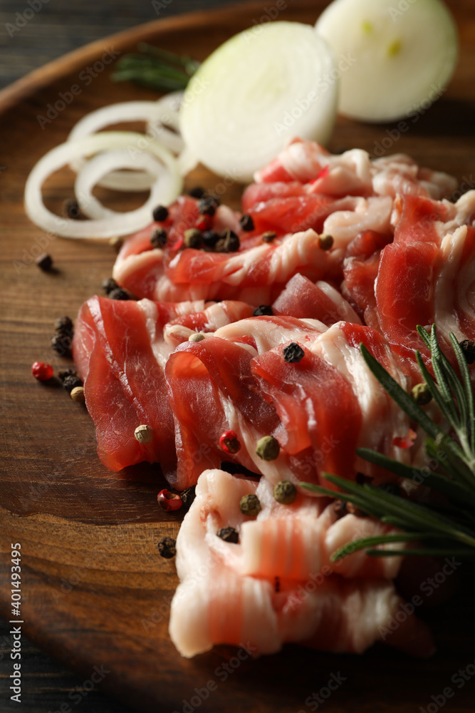 Concept of tasty snack with bacon on wooden background Concept of tasty snack with bacon on wooden background