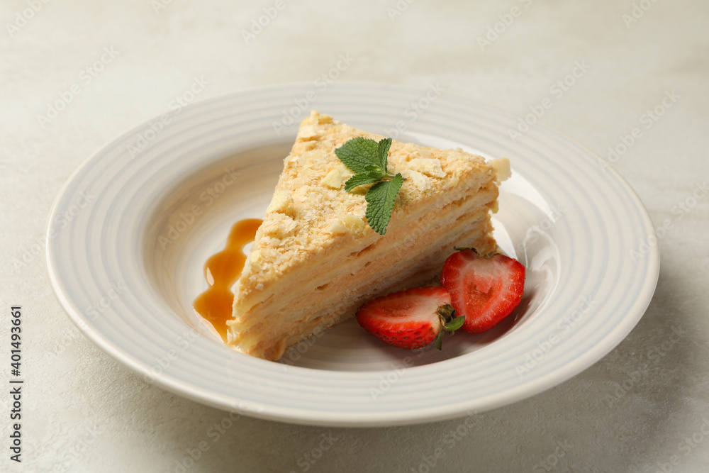 Plate with delicious Napoleon cake on white - gray background Plate with delicious Napoleon cake on white - gray background