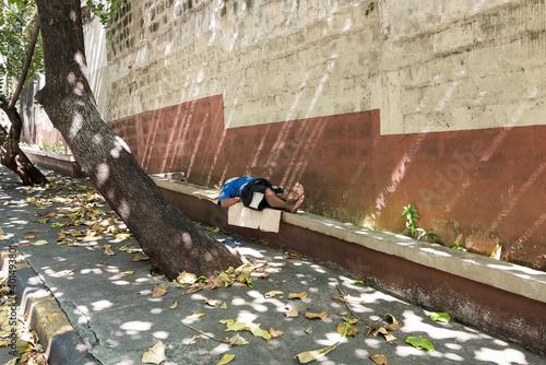 Homeless male sleeping on the streets during Coronavirus lockdown. 