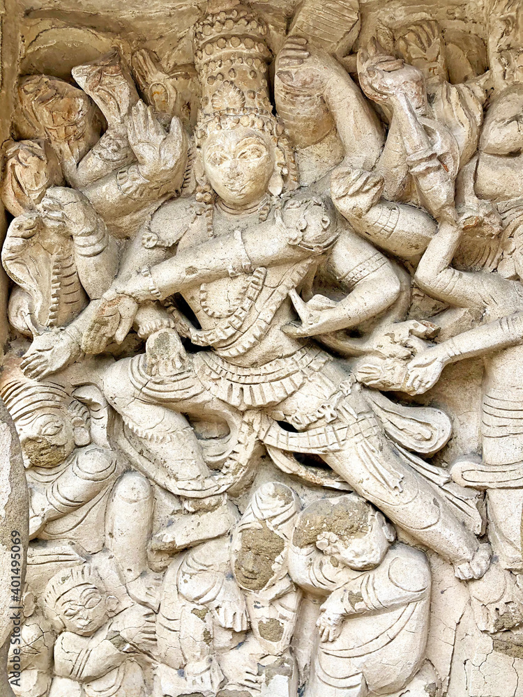 Hindu God deity statue. Ancient sandstone carved historical Hindu God