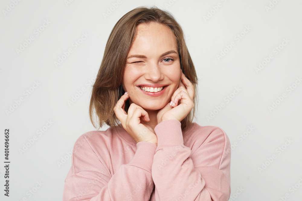Young and cheerful blonde woman smiling and laughing looking at the camera Young and cheerful blonde woman smiling and laughing looking at the camera