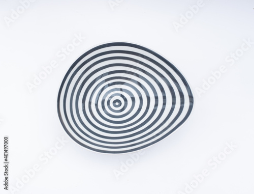 Porcelain bowl with concentric circles - op art object isolated