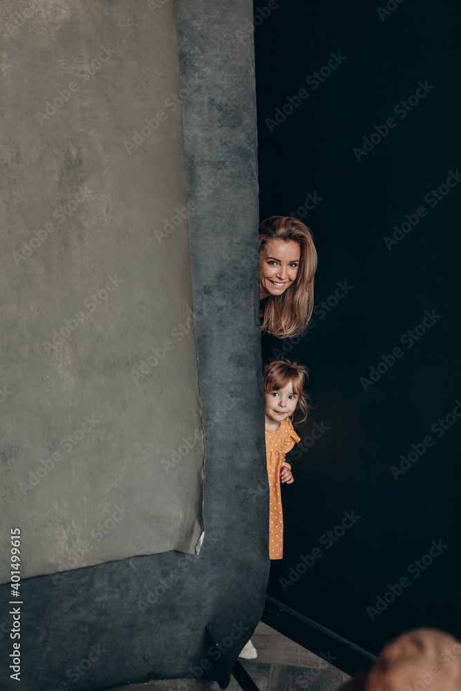 Young mother with her little daughter. Maternal love for a child. Studio photography. Young mother with her little daughter. Maternal love for a child. Studio photography.