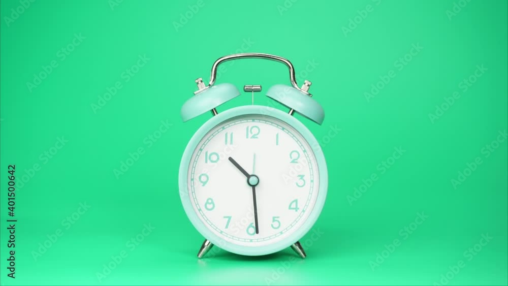 Blue Alarm clock Ten o'clock isolated on green background, Time lapse 1 hour.
Blue Alarm clock Ten o'clock isolated on green background, Time lapse 1 hour.