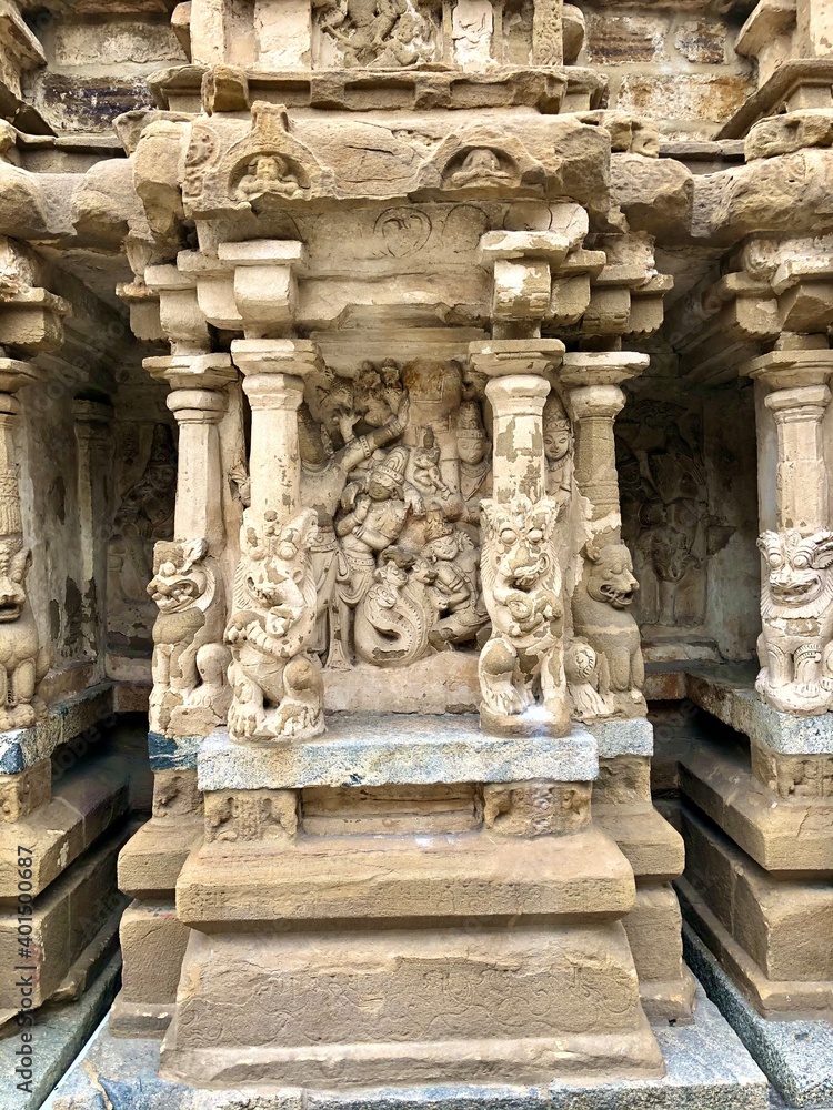 Hindu God deity statue. Ancient sandstone carved historical Hindu God sculptures in the temple walls. Hindu God deity statue. Ancient sandstone carved historical Hindu God sculptures in the temple walls.