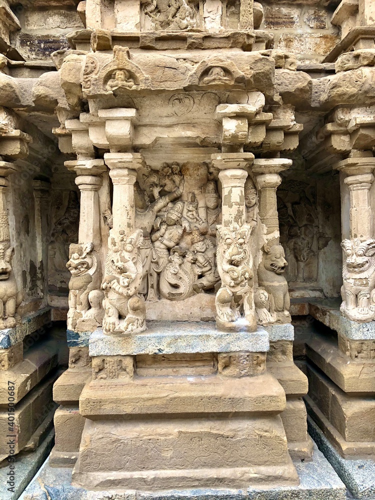 Hindu God deity statue. Ancient sandstone carved historical Hindu God sculptures in the temple walls.