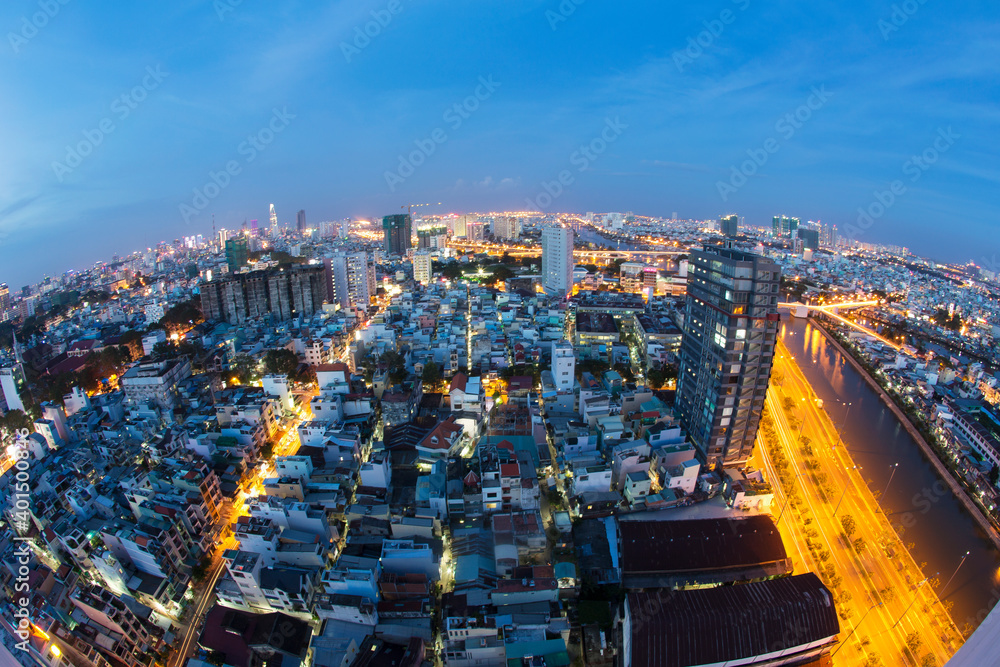 Naklejka premium Beautiful night city, cityscape of Ho Chi Minh city, Vietnam, modern futuristic architecture nighttime illumination, luxury traveling concept.