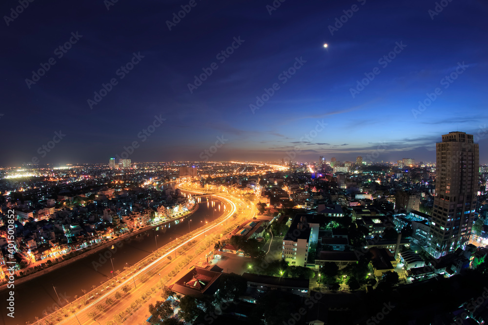 Beautiful night city, cityscape of Ho Chi Minh city, Vietnam, modern futuristic architecture nighttime illumination, luxury traveling concept.