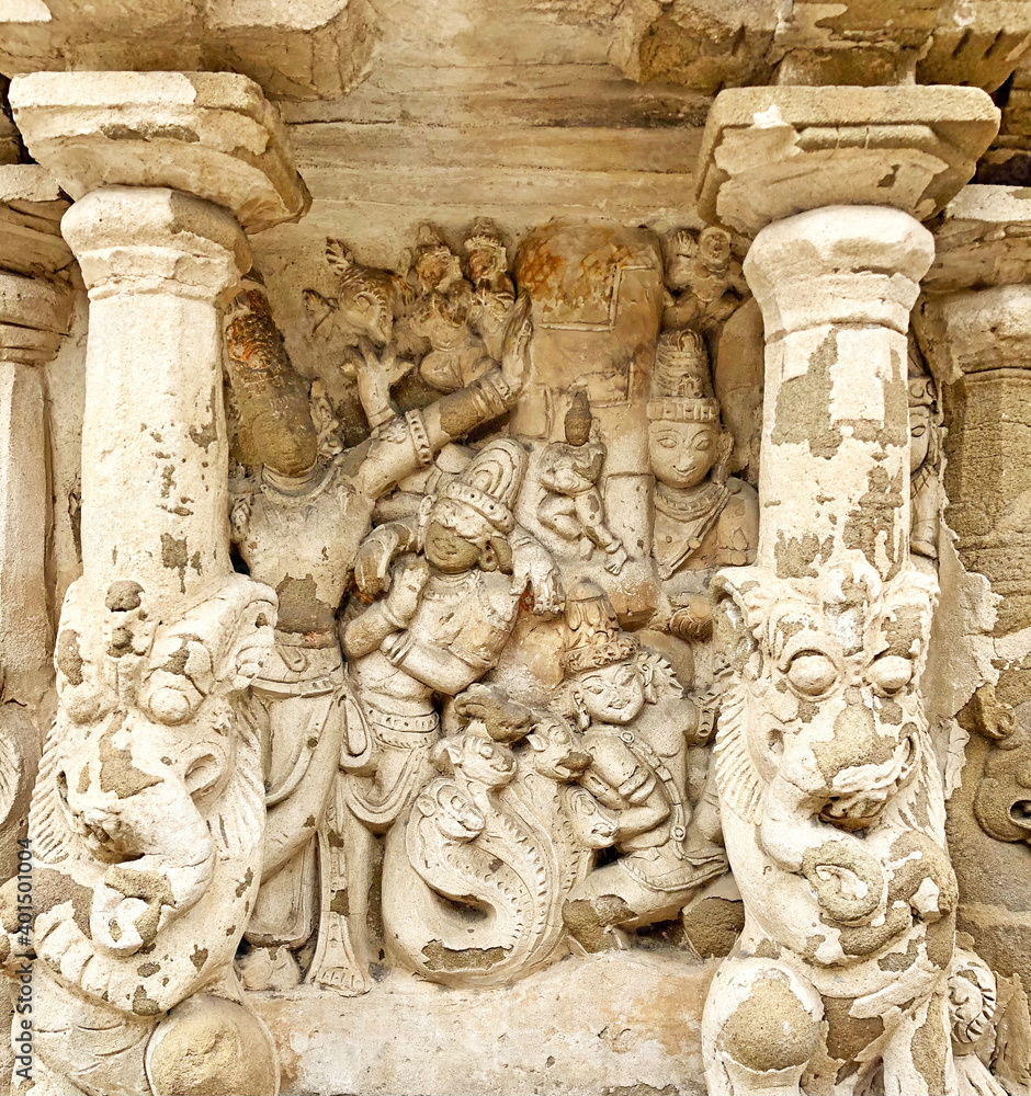 Hindu God deity statue. Ancient sandstone carved historical Hindu God