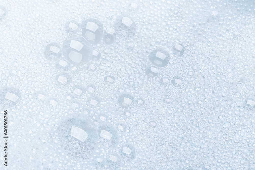 Background of soap foam and bubbles on a white background, macro photography Background of soap foam and bubbles on a white background, macro photography