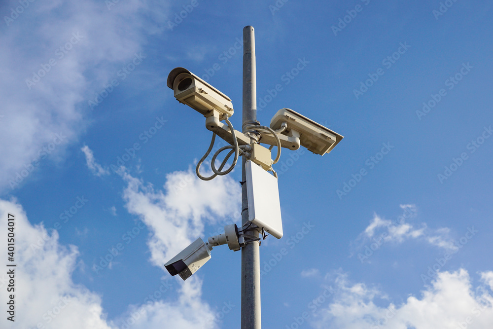 Security cctv cameras in front of blue sky Security cctv cameras in front of blue sky