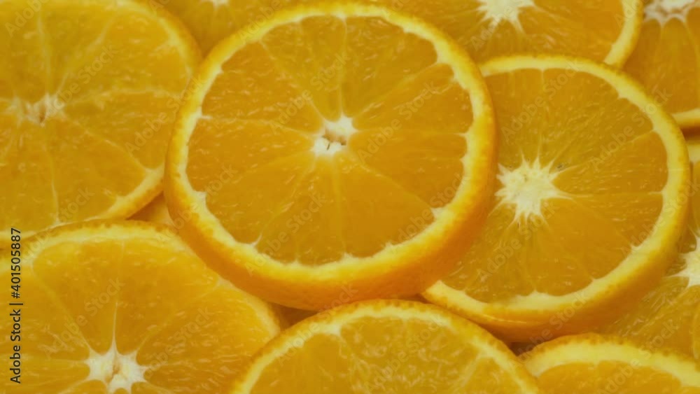 Fresh Cut Pieces Of Oranges Citrus Fruits, Isolated. Background of Orange Slices. Healthy Vitamin Vegan Food and Vegetarian Diet. Fresh Cut Pieces Of Oranges Citrus Fruits, Isolated. Background of Orange Slices. Healthy Vitamin Vegan Food and Vegetarian Diet.