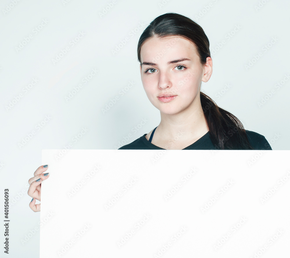 young pretty brunette girl with placard shit copyspace on white background wearing business costume student young pretty brunette girl with placard shit copyspace on white background wearing business costume student