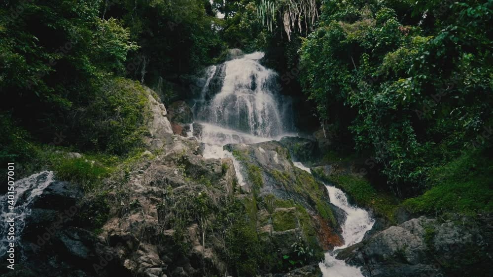 Waterfall in the jungle on a tropical island on a sunny day Waterfall in the jungle on a tropical island on a sunny day