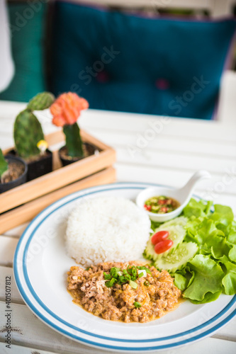 Garlic Pepper Pork Rice with vegetables Serving on table