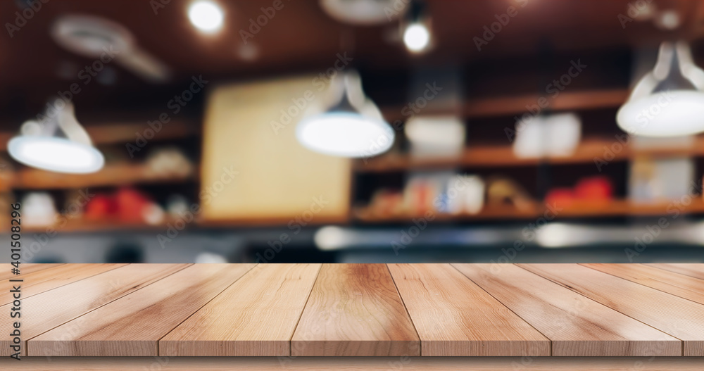 Empty wood table on blur restaurant background. Empty wood table on blur restaurant background.