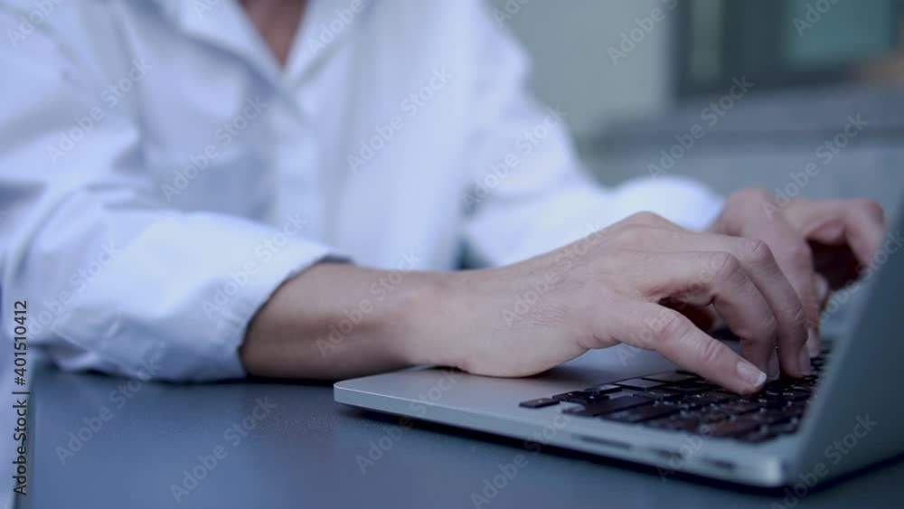 Close-up female hands typing on laptop keyboard, woman chatting or working on pc Close-up female hands typing on laptop keyboard, woman chatting or working on pc