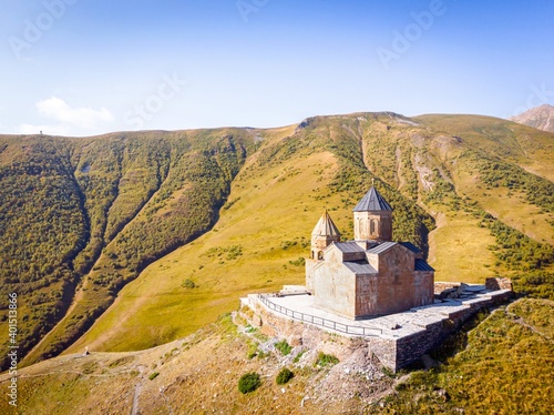 Aerial view of Gergeti trinity church on the hill with no tourist. KAzbegi photo