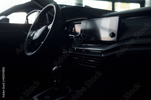 Inside of front part. Close up focused view of brand new modern black automobile © standret