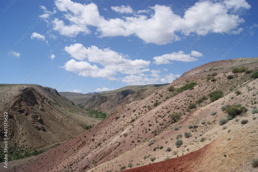 An unusual natural area in the Altai mountains with colored soil similar to the Martian landscape. Natural attraction of Altai. Popular tourist routes in Russia.