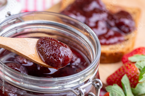 Bowl of strawberry jam isol...