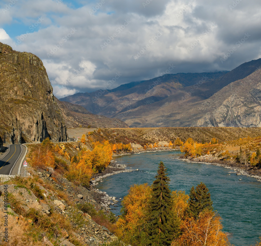 Russia. Mountain Altai. Autumn coast of the Katun river near the mouth of the right tributary of the Chuya.
