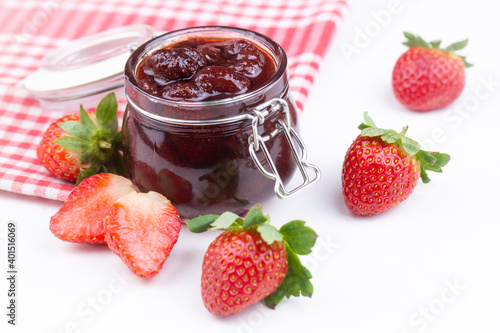 Delicious strawberry jam in a glass jar