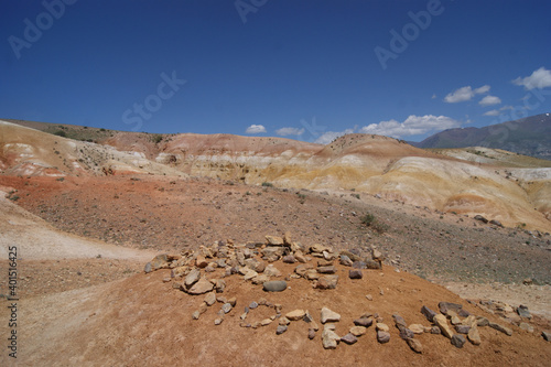 An unusual natural place in the Altai mountains with colored soil similar to the Martian landscape. Natural landmark of Altai. The name Pauline is made of stones. Popular tourist routes in Russia.