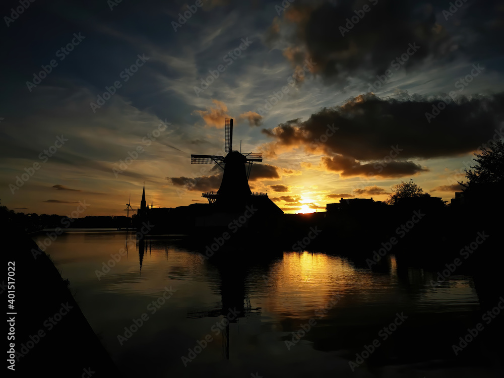 City sunset of the extinction of the sun over the horizon. Leidschendam. South Holland